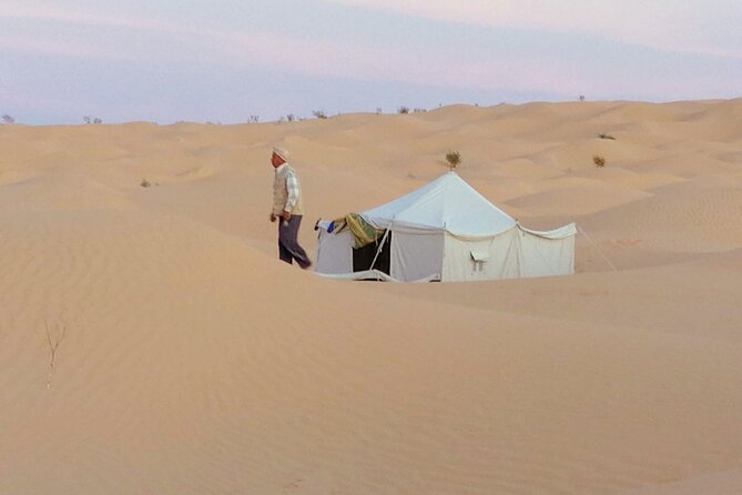 2 days tour to Douz & Ksar Ghilan oasis. and an overnight in the sahara under bedouin tent .. Dinner in the camp, Private Jeep - with english speaking guide. - The road to Douz and the overnight desert camp
